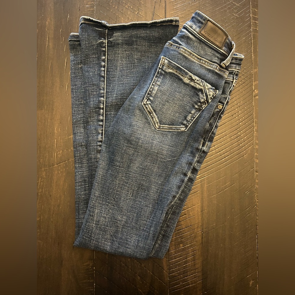 Buckle black bootcut jeans